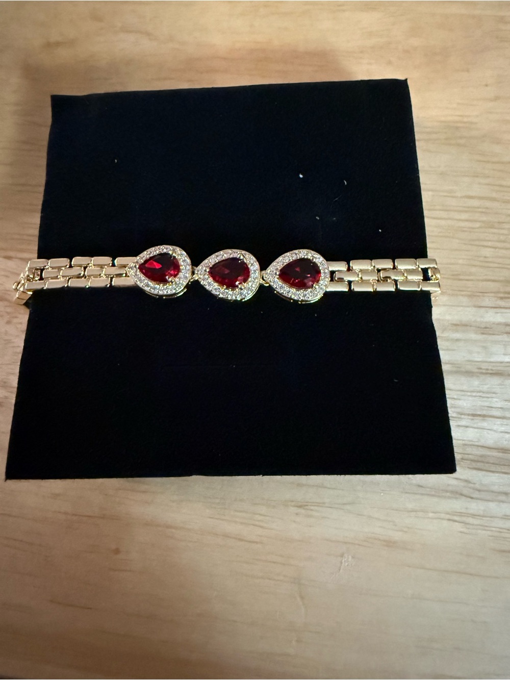 Gold Bracelet with Red Teardrop Gemstones